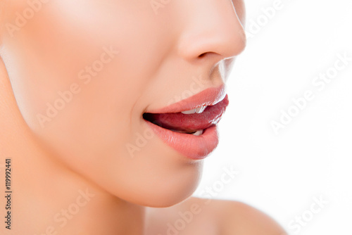 Close up of young woman licking her beautiful lips
