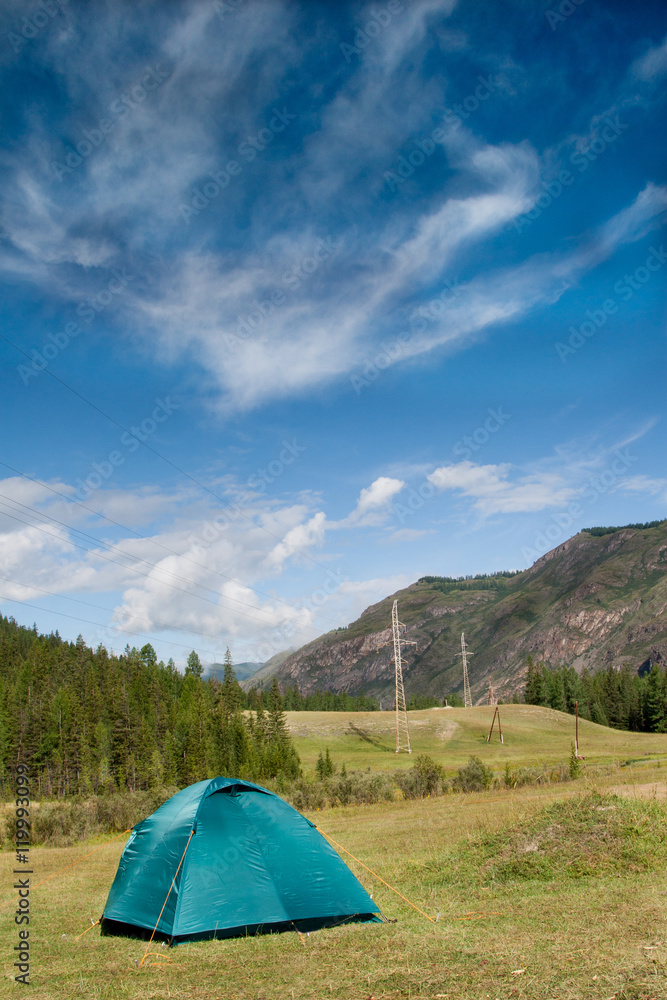 Summer landscape with a tent in the mountains of Altai