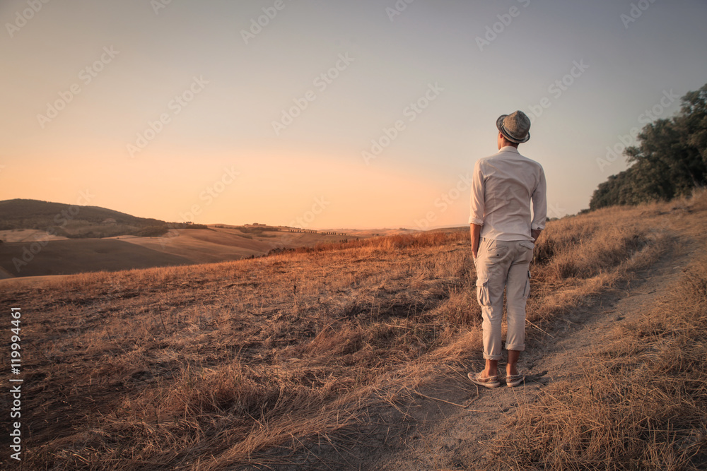 Guy admiring the panorama in the countryside Guy admiring the panorama in the countryside