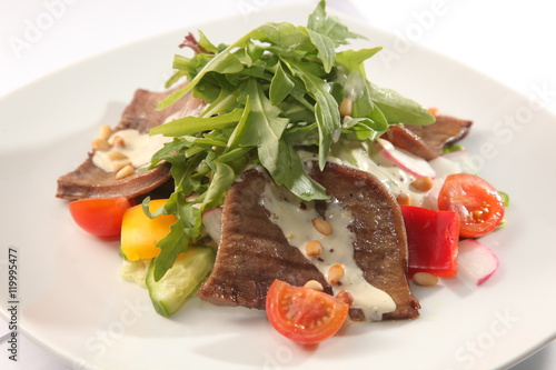 Salad with beef tongue and sauce