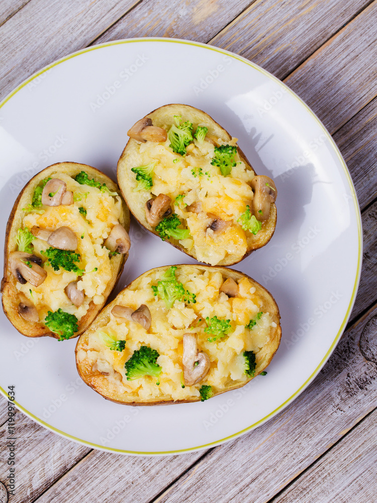 Fototapeta premium Broccoli, Cheese and Mushroom Chowder Potato. View from above, top studio shot