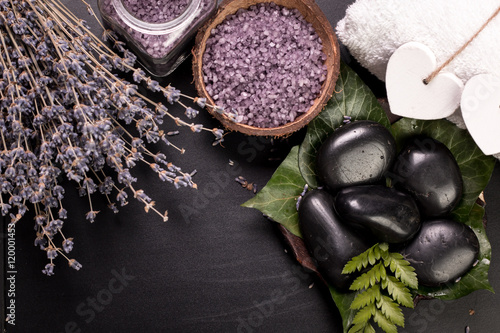 spa concept with stones, flowers , essential oils and mineral salt photo