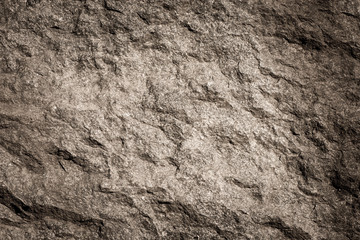 Fototapete Steine Steinhintergrund, Felswandhintergrund mit rauer Beschaffenheit. Abstrakte, grungy und strukturierte Oberfläche des Steinmaterials. Naturdetail von Felsen.  © larshallstrom