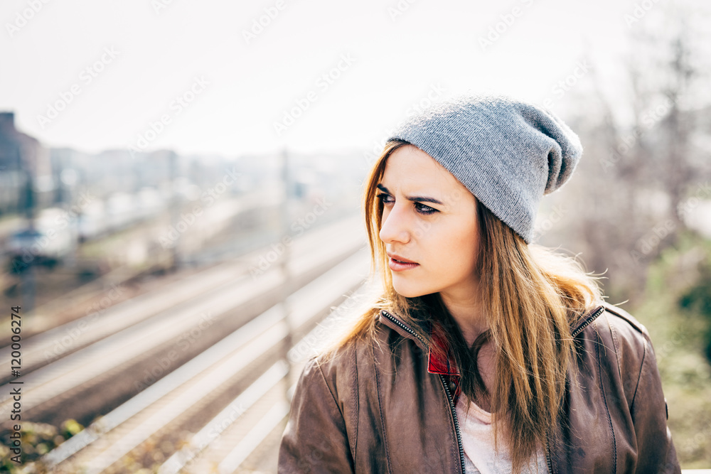 Fototapeta premium Half length of young beautiful caucasian blonde hair woman outdoor in the city, overlooking pensive - thoughtful, serious, thinking future concept