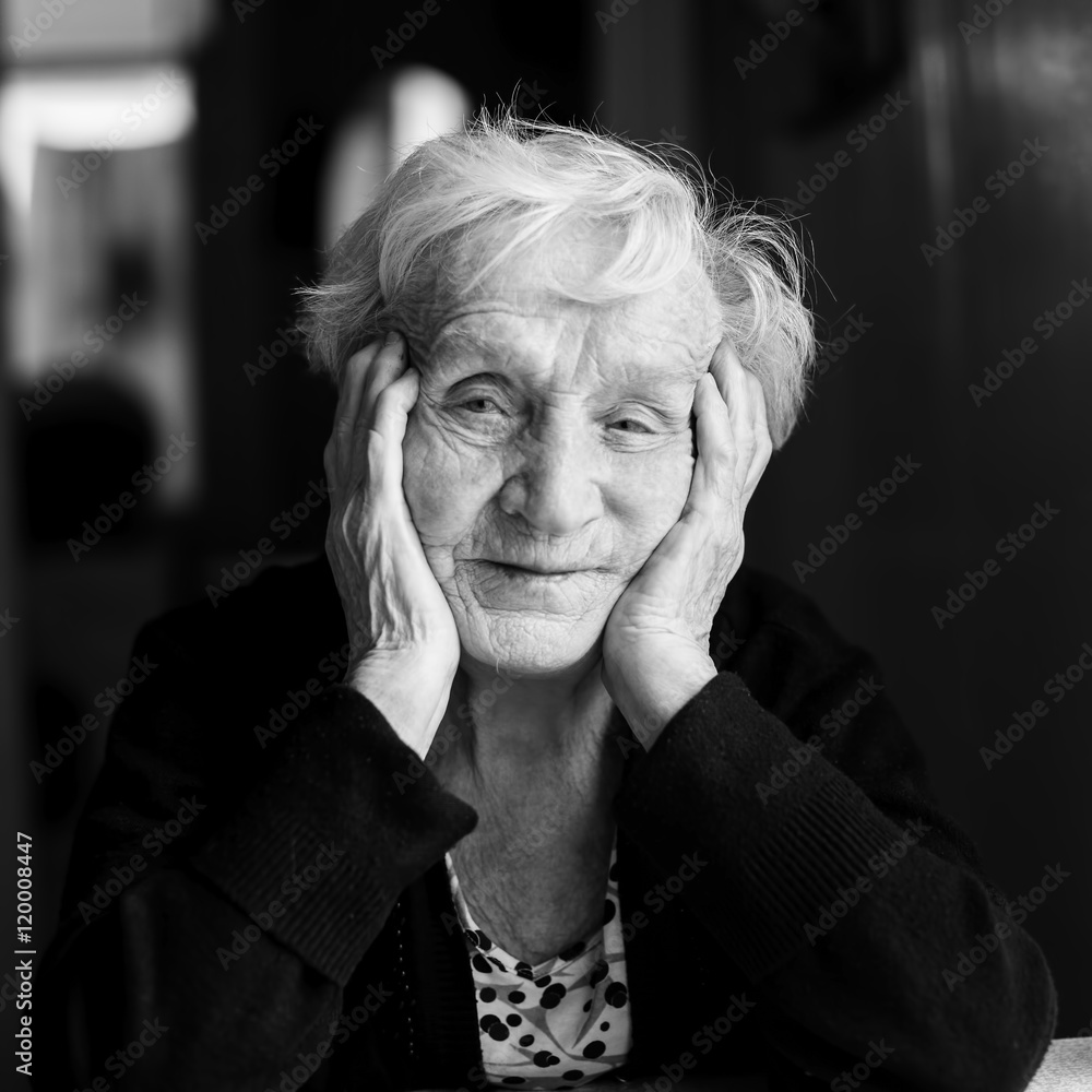 Close-up black and white portrait of an elderly woman. Close-up black and white portrait of an elderly woman.