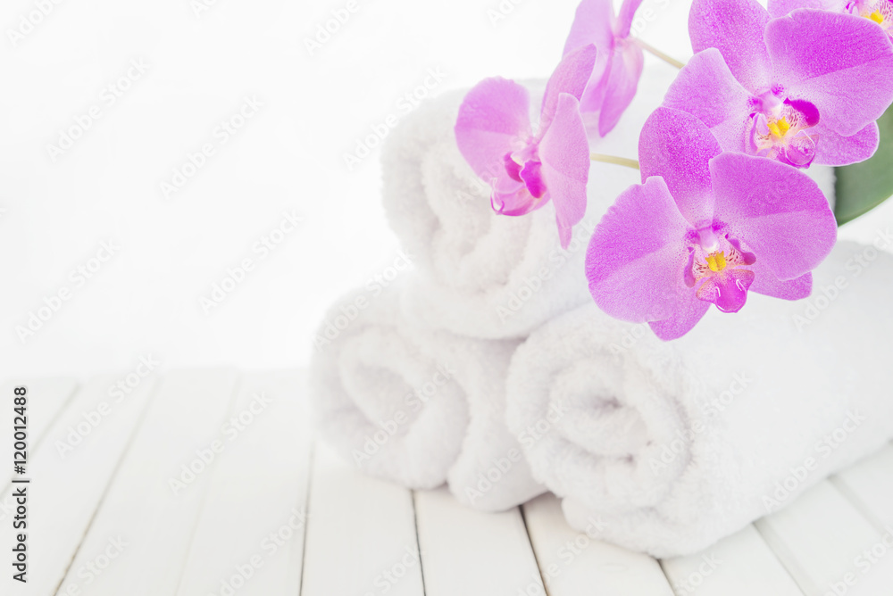 White bath towels and orchid flower White bath towels and orchid flower