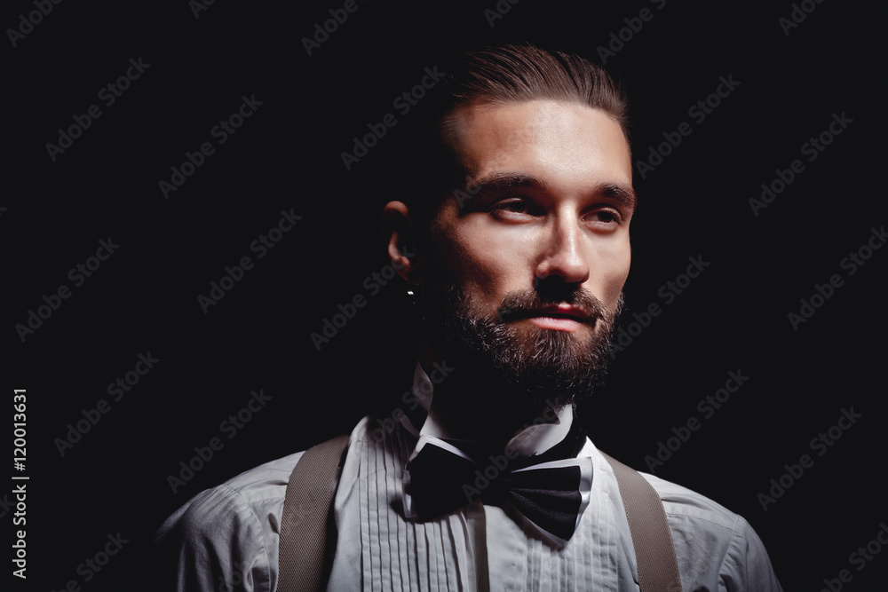 Portrait of handsome man posing for photographer in studio Portrait of handsome man posing for photographer in studio