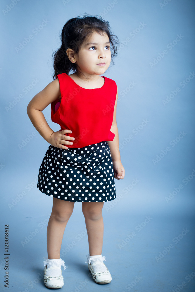 Small girl playing and posing isoated inside studio Small girl playing and posing isoated inside studio