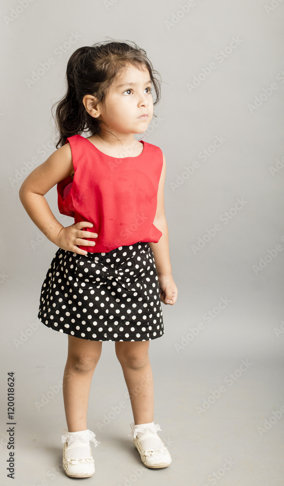 Small girl playing and posing isoated inside studio Small girl playing and posing isoated inside studio