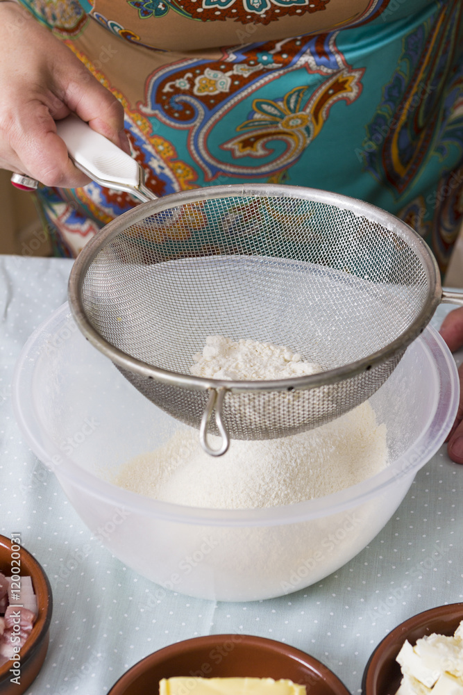 Mature woman with flour in kitchen Mature woman with flour in kitchen