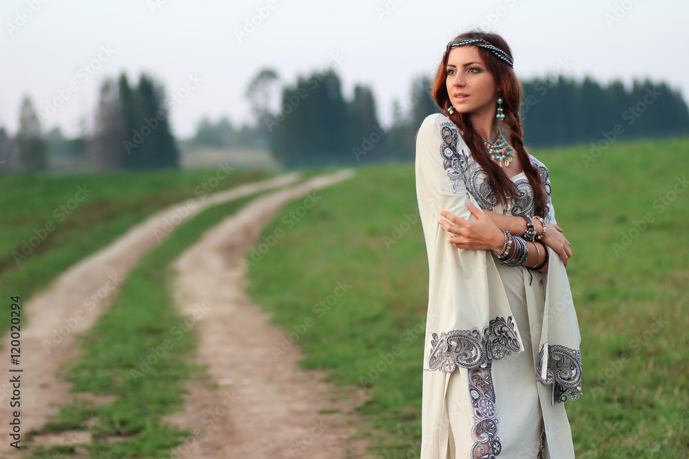 Naklejka premium girl in long dress road country