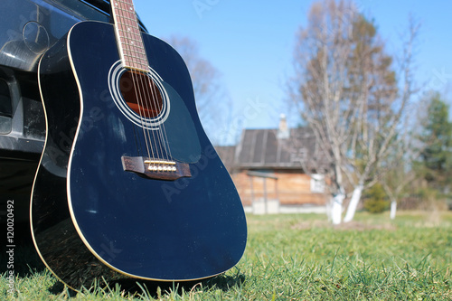 guitar outdoor near car photo