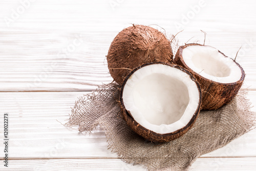 Coconut on wooden table.