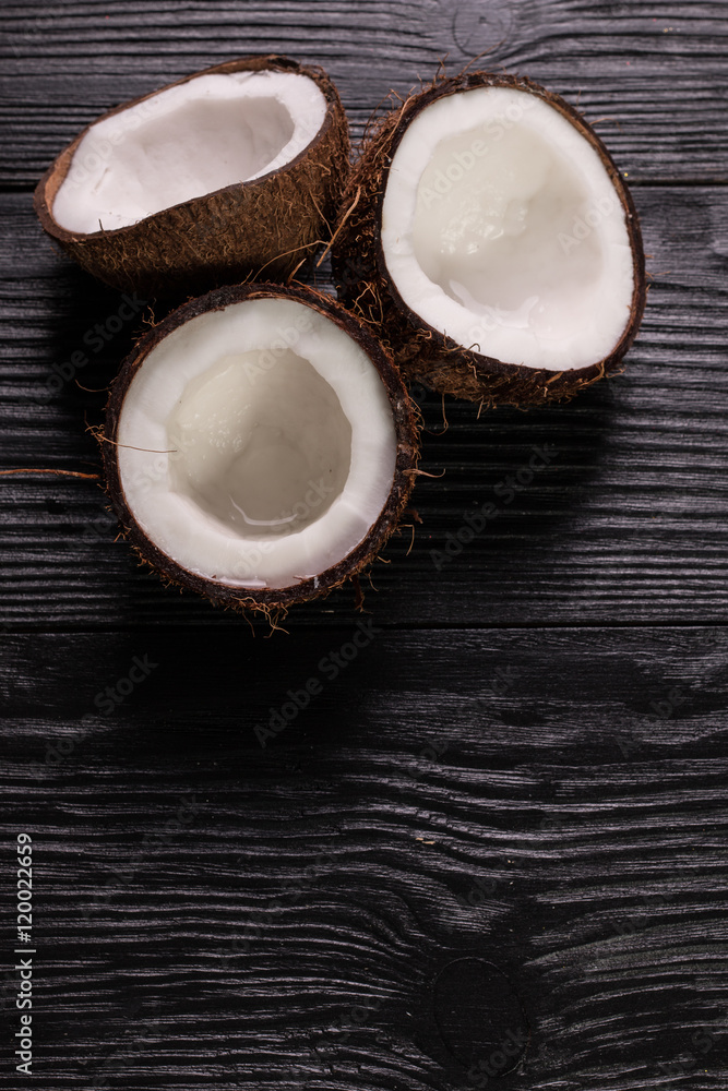 Coconut on wooden table. Coconut on wooden table.