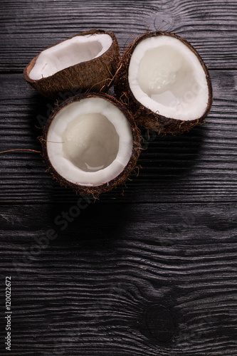 Fototapeta Naklejka Na Ścianę i Meble -  Coconut on wooden table.