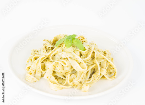 Tagliatelle with pesto decorated with basil