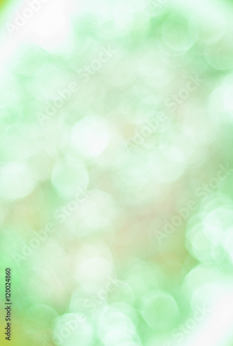 Blurred background with bokeh lights in green pastel colours