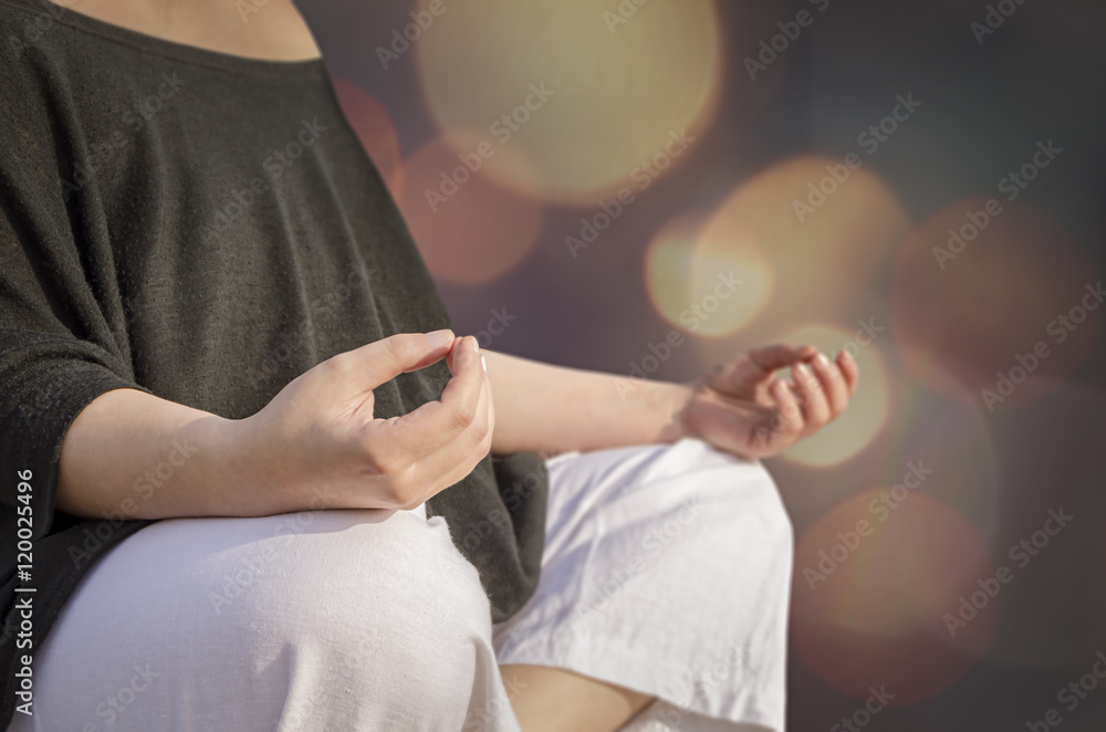 Closeup of woman's hands meditating. Yoga and meditation concept