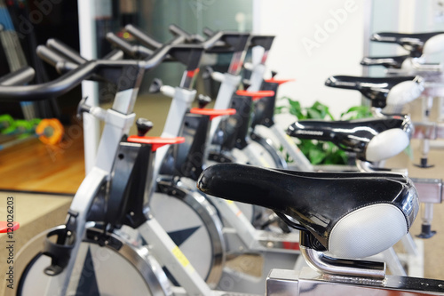 Interior of a modern fitness hall with the exercise bicycles