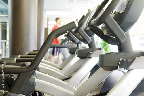 Interior of a modern fitness hall with close-up ellipticals
