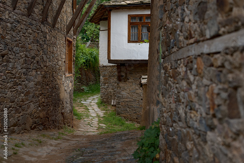Fototapeta Naklejka Na Ścianę i Meble -  Summer time along the streets of Kovachevitsa village, Bulgaria