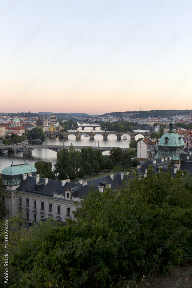 Evening Prague City with its Bridges and Towers above River Vltava, Czech Republic