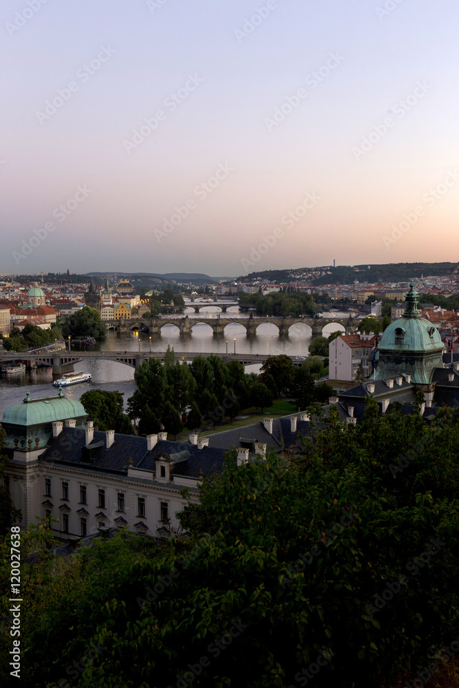 Evening Prague City with its Bridges and Towers above River Vltava, Czech Republic
