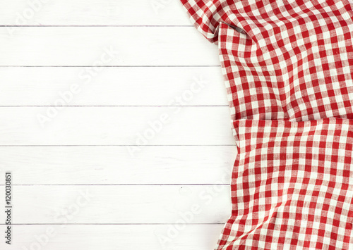 Red tablecloth on white wooden table