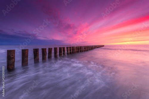 Wooden breakwater - Baltic seascape at sunset  Poland