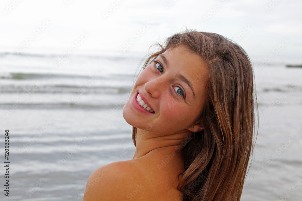 Girl smiles on the sea