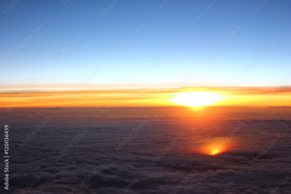 Sunrise above clouds from an airplane