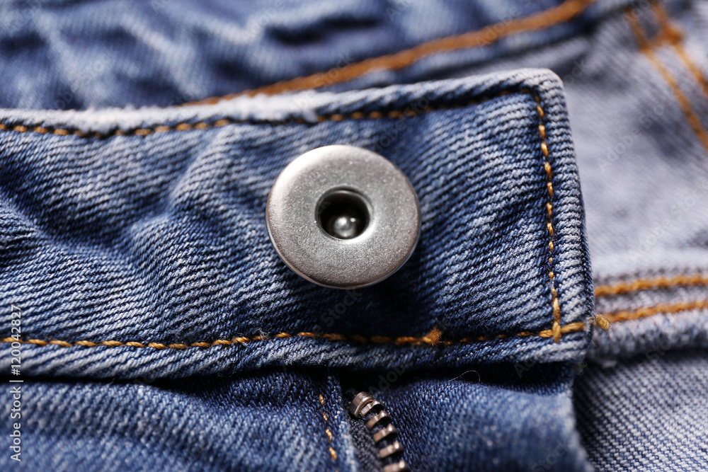Button on a denim cloth close up Button on a denim cloth close up
