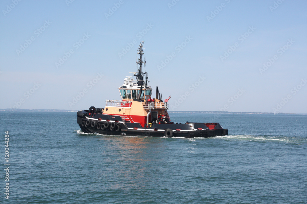 Fototapeta premium Tugboat; This working tugboat is on it's way out to sea.