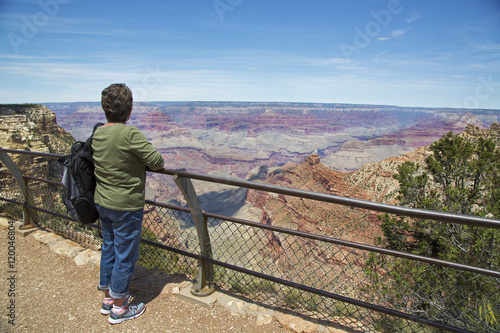 A woman views the Grand Canyon National Park from one of the many overlook points along the South Rim.