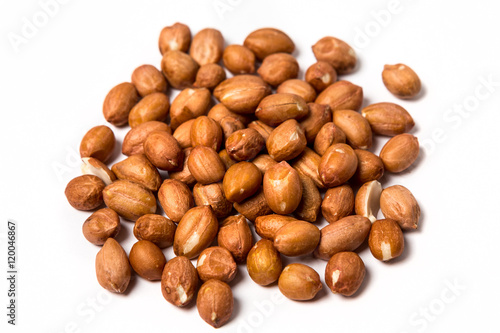 Raw spanish peanuts isolated on white