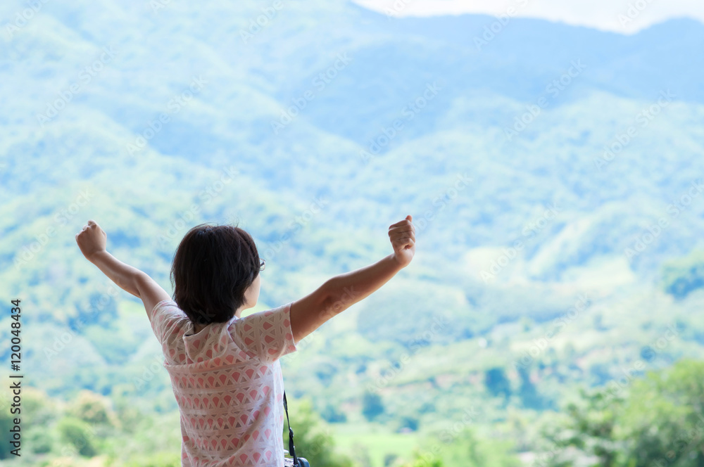 Asian woman standing at balcony and looking on the landscape. Asian woman standing at balcony and looking on the landscape.