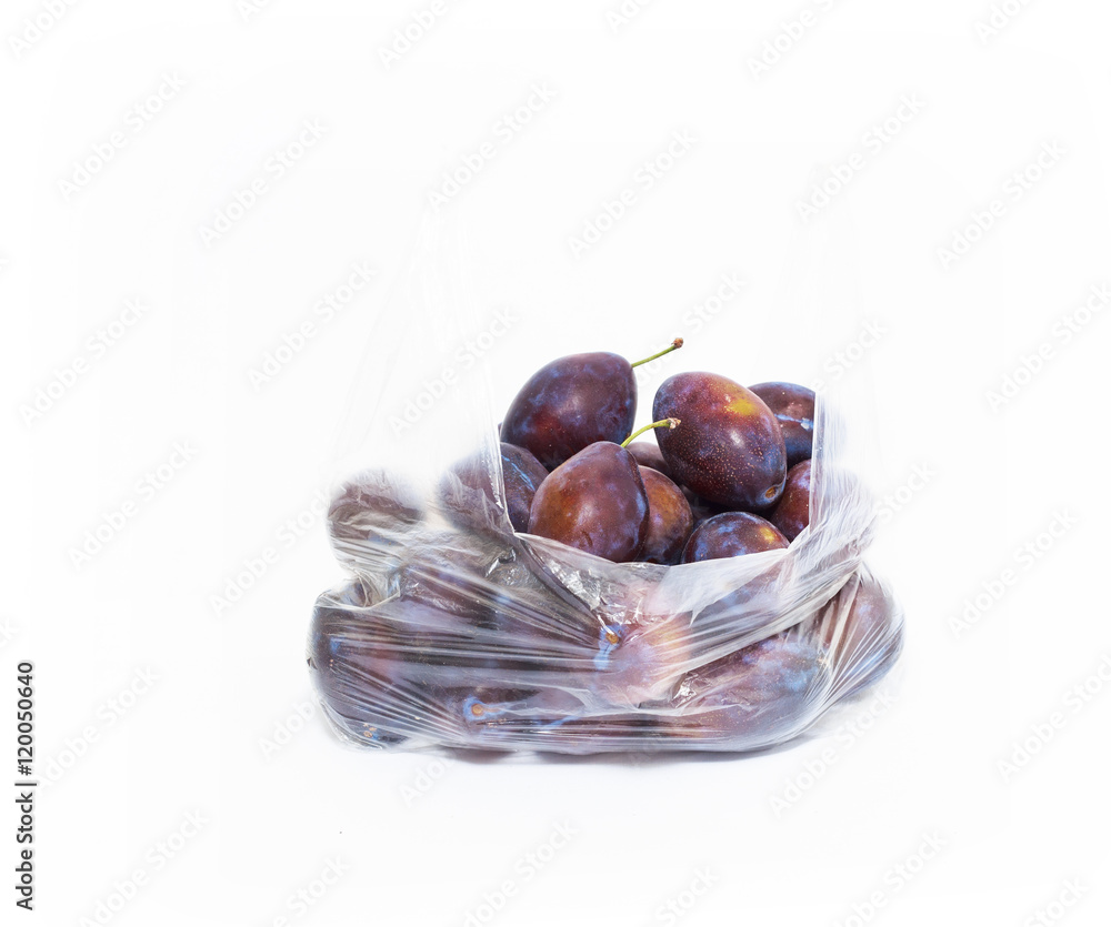 Obraz premium organic plum from market in plastic bag, natural 