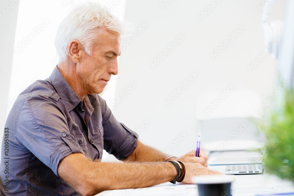 Handsome businessman in office Handsome businessman in office