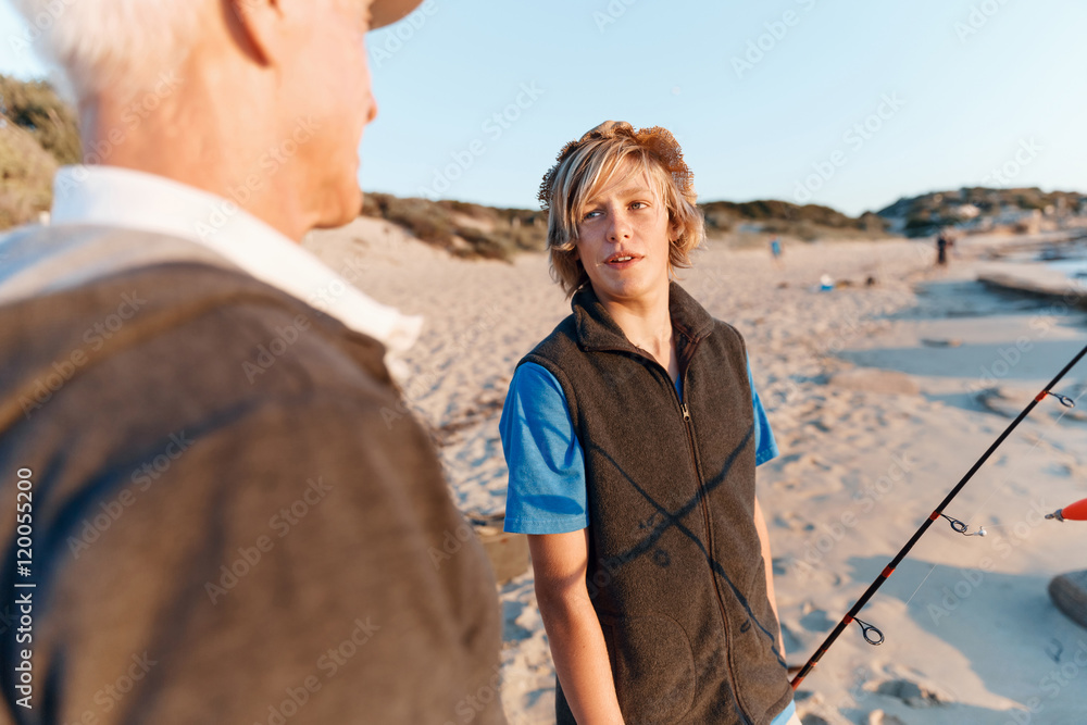 Senior man fishing with his grandson Senior man fishing with his grandson