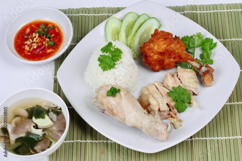 Streamed oily rice and streamed chicken as "Hainanese chicken rice" and deep fried chicken served with spicy soy bean sauce and mushroom soup.