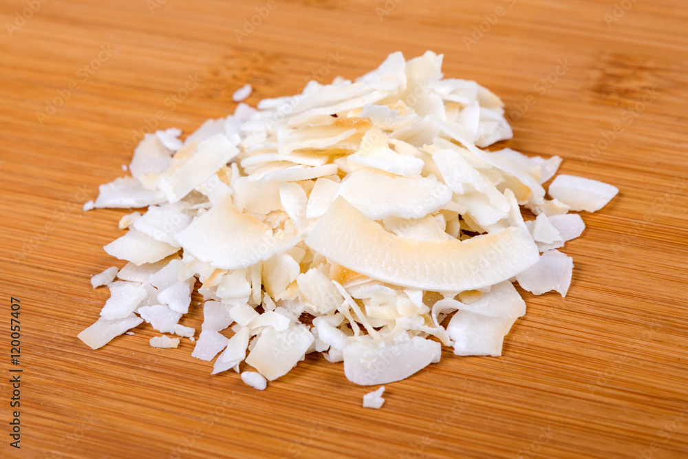 Dried coconut isolated on wood background Dried coconut isolated on wood background
