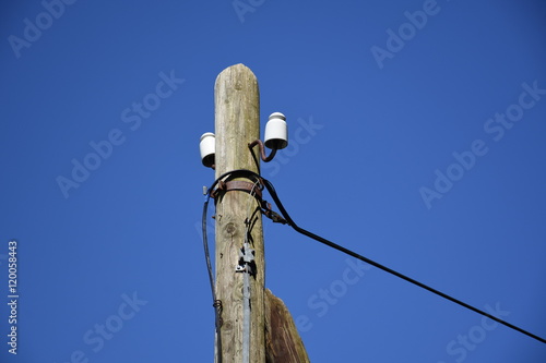 Stromleitung, Mast, Holzmast, Isolator, Isolatoren, Kabel, Leitung, Strom  Stock Photo | Adobe Stock