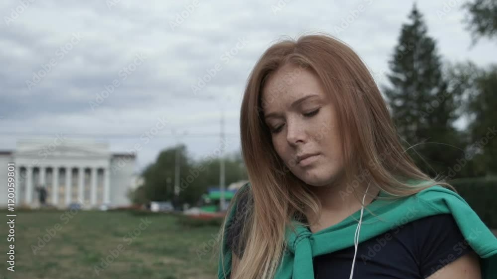 Pensive red-haired student sits Pensive red-haired student sits