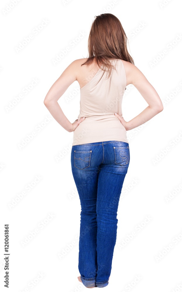 Back view of beautiful yong woman looks ahead. rear view. Isolated over white . Back view of beautiful yong woman looks ahead. rear view. Isolated over white .