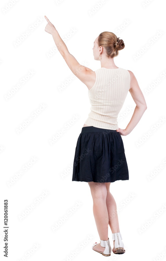 Back view of pointing woman. beautiful blonde girl. Rear view people collection. backside view of person. Isolated over white background. Back view of pointing woman. beautiful blonde girl. Rear view people collection. backside view of person. Isolated over white background.