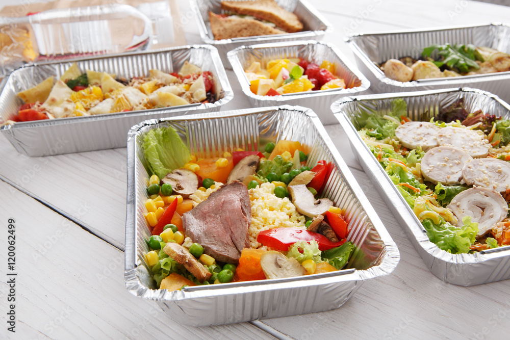 Healthy food in foil boxes, diet concept.