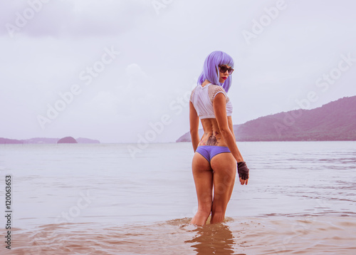 Valokuva Sexy beautiful woman in modern futuristic style posing in the se
