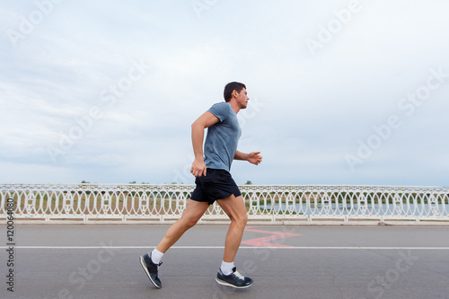 Jogging lifestyle - young attractive man running outdoors