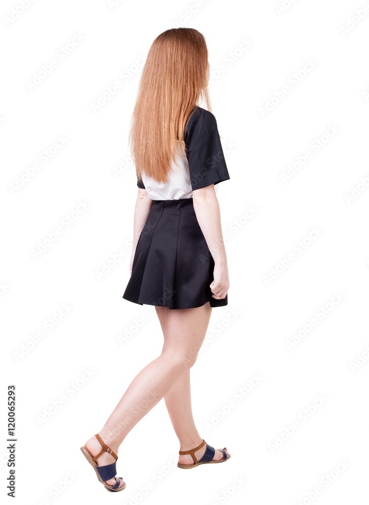 back view of walking woman. beautiful redhead girl in motion. backside view of person. Rear view people collection. Isolated over white background. back view of walking woman. beautiful redhead girl in motion. backside view of person. Rear view people collection. Isolated over white background.