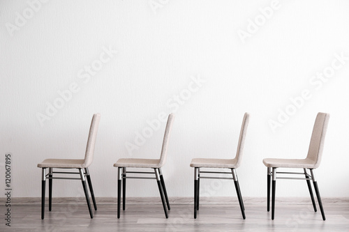 Set of chairs in light room interior